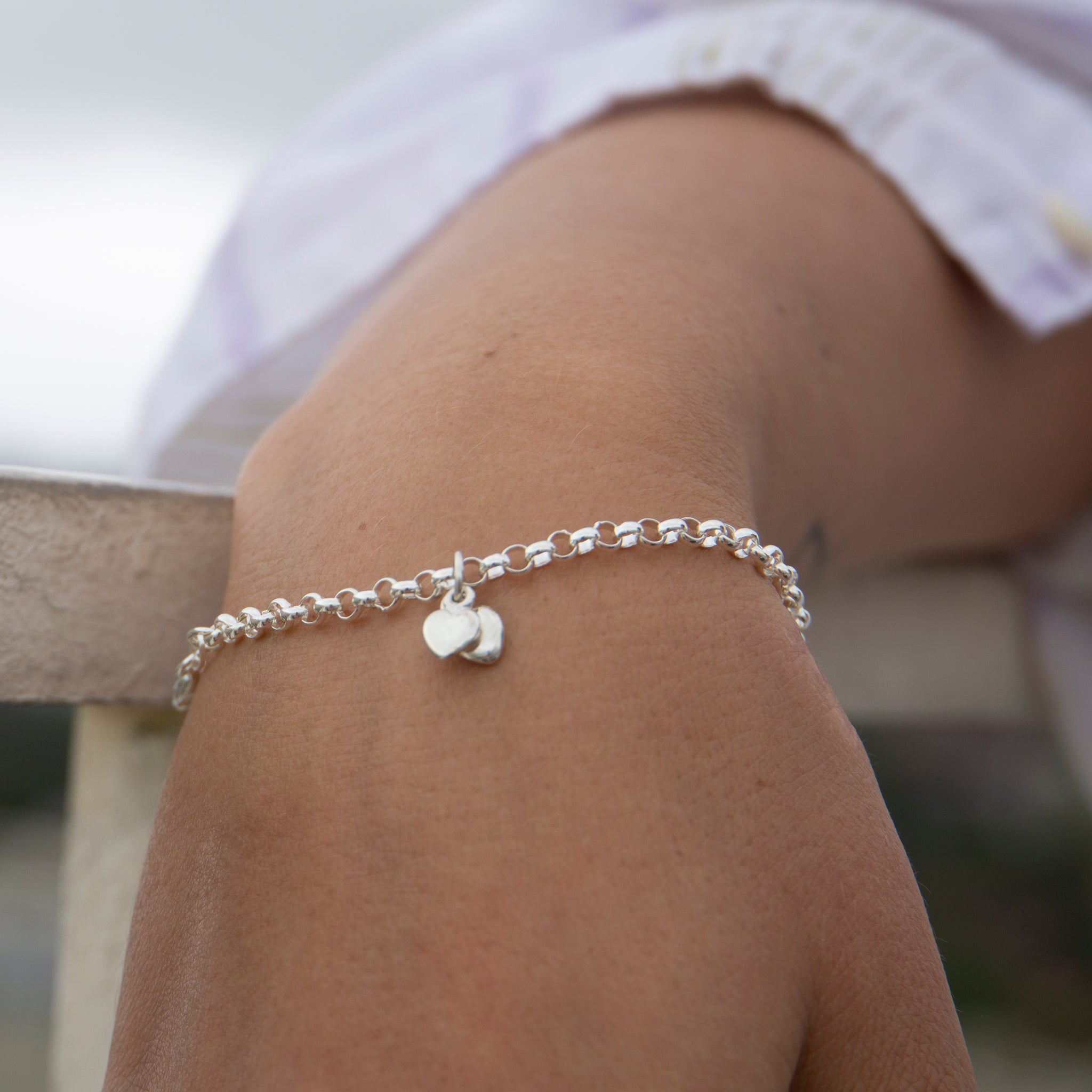 chunky white gold bracelet with charm on hand australia