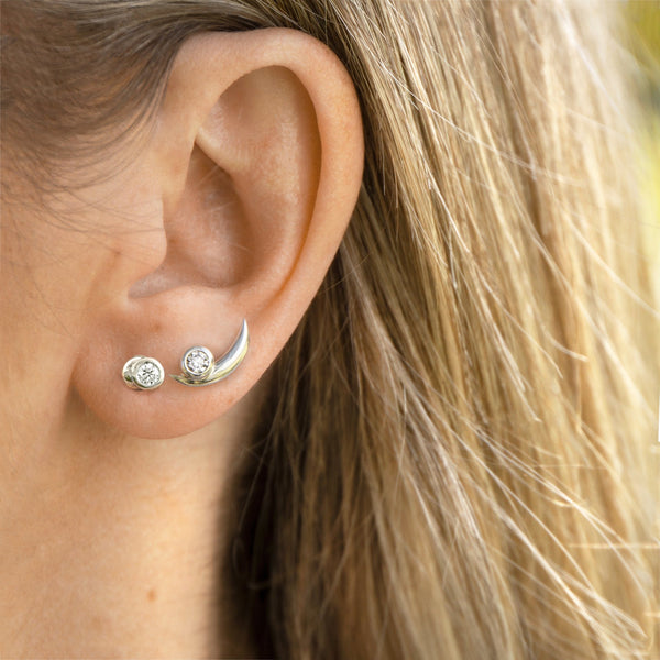 White gold diamond earrings mix and match on one ear look