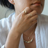 Two styles of bezel set yellow gold diamond ring