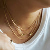 gold diamond necklace stack AïANA