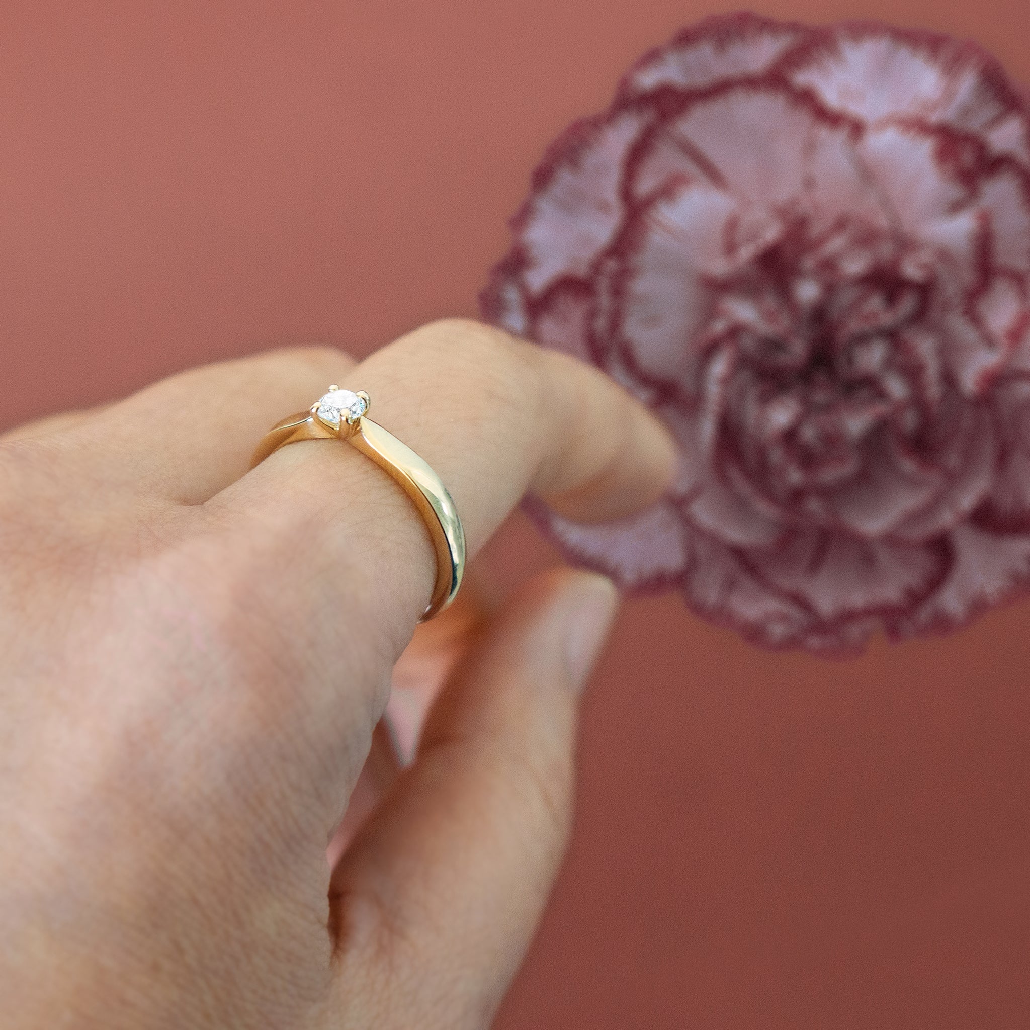 Solitaire yellow gold lab diamond ring on finger - AïANA